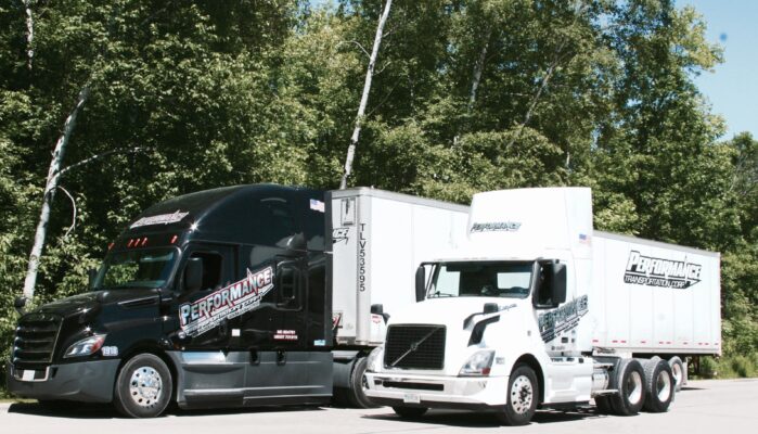 Performance LLC semi trucks delivering sustainable wood products and logistics solutions.